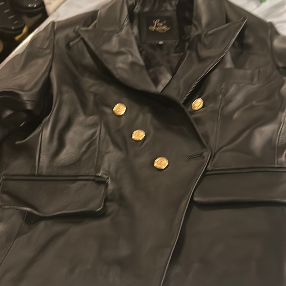 Brand new black 100% leather blazer double breasted. NEVER WORN